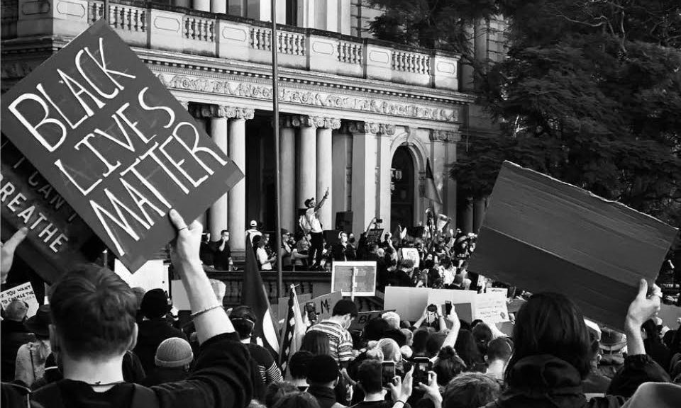A black and white photo of people protesting at the 2020 Black Lives Matter Protest