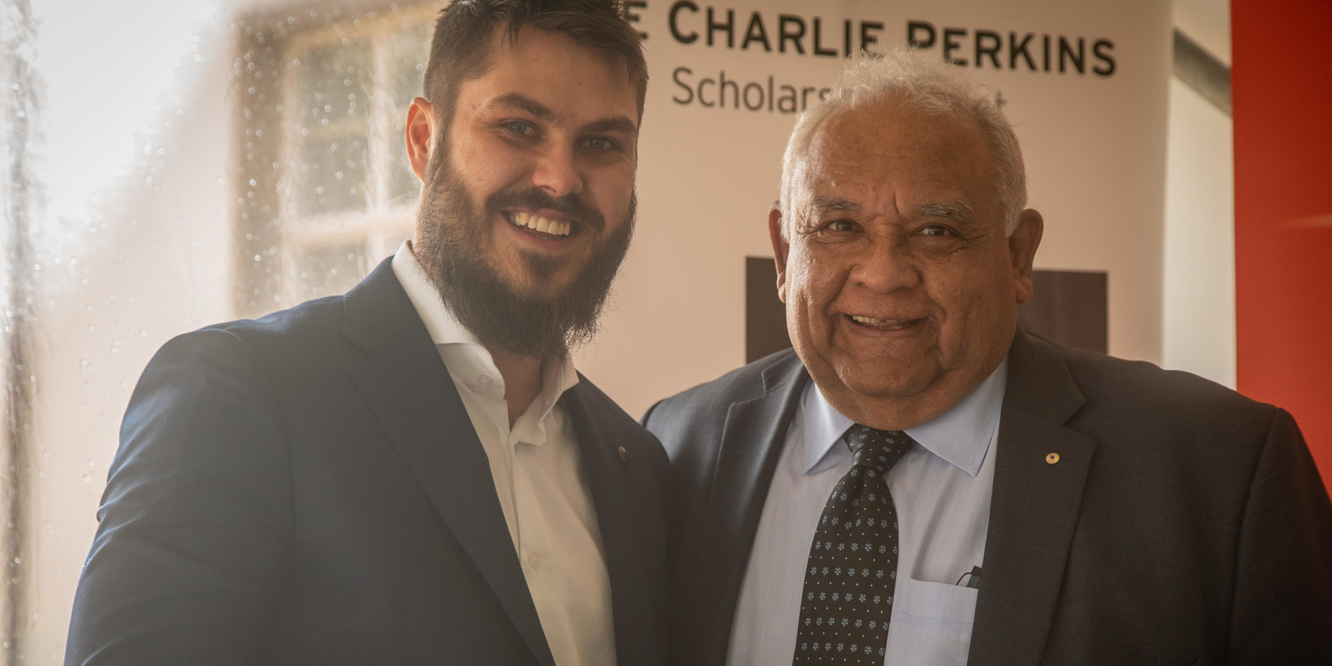 Ethan Taylor with his arm around Tom Calma AO.