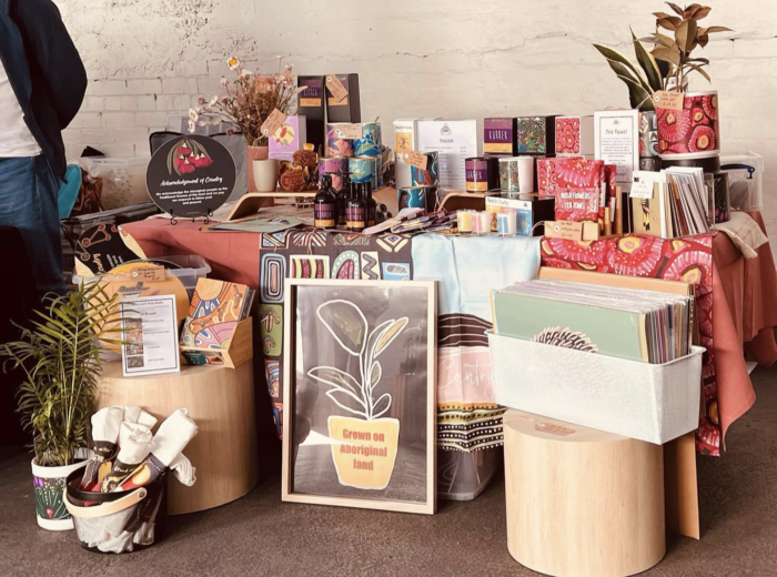 A stall with different home decor options such as paintings.